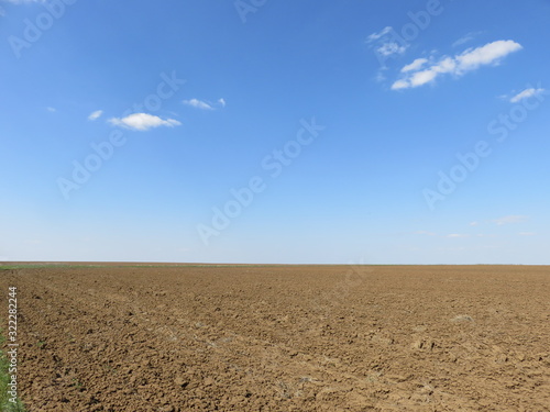 Plowed field and blue sky
