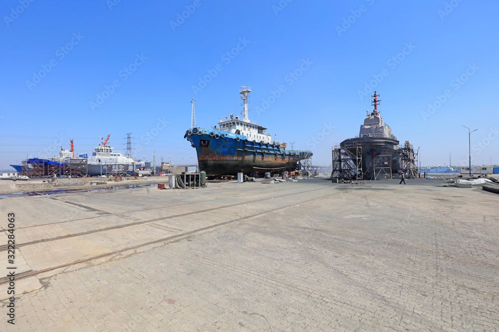 Fototapeta premium Ships awaiting repair are at the shipyard, Luannan County, Hebei Province, China