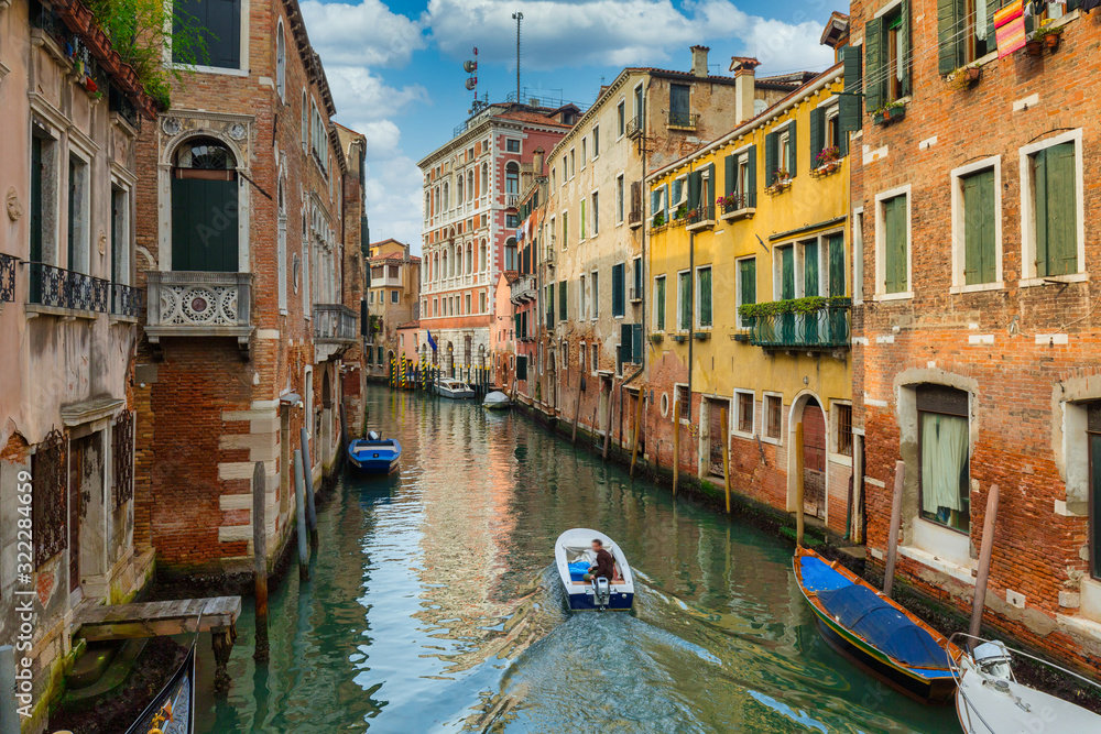 Canals of Venice city with traditional colorful architecture, Italy
