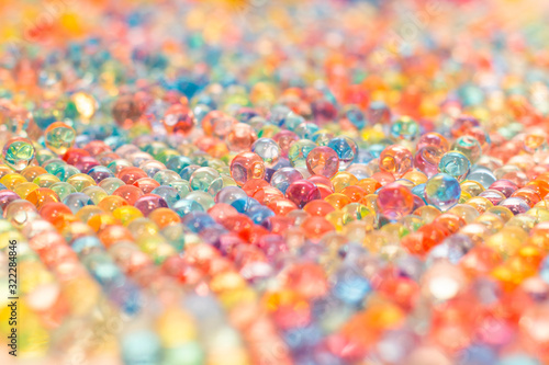 Background of many multicolored shiny balls with soft blur around the edges © Alexey