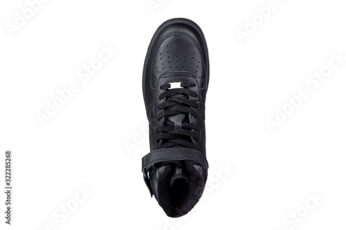 One black sneaker on a white background top view.