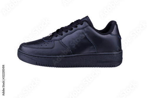 One black sneaker on a white background. Sport shoes.