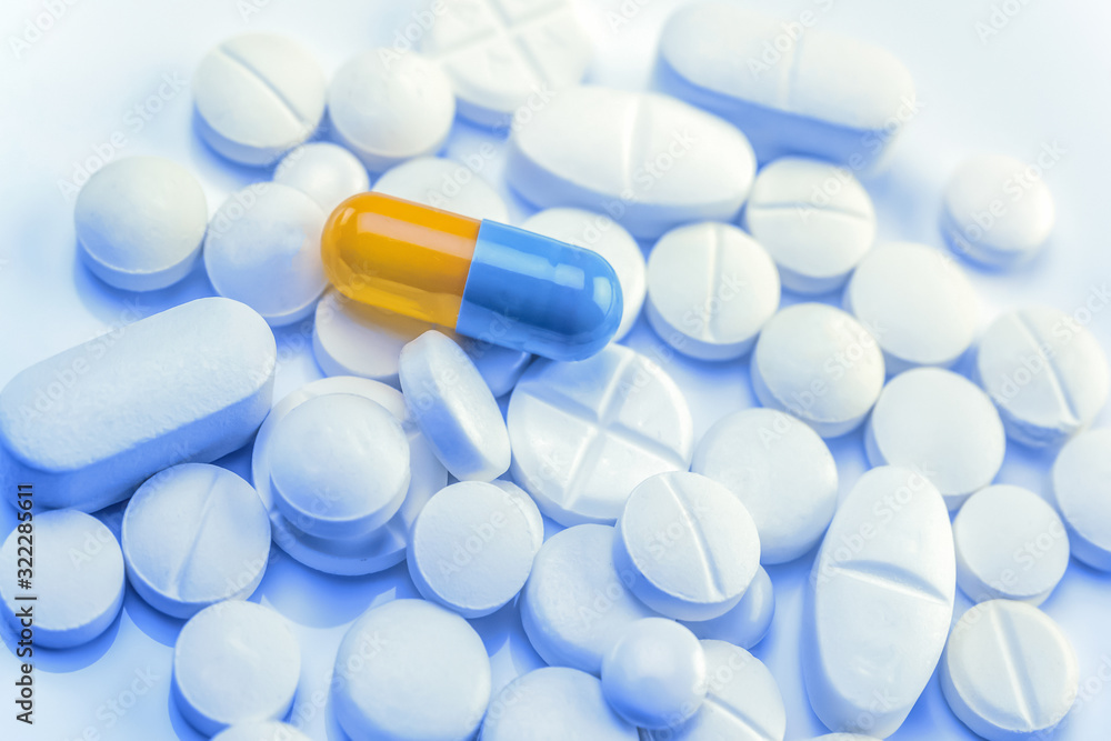 Pills with capsule, treatment concept. Pills with capsule, treatment concept.
