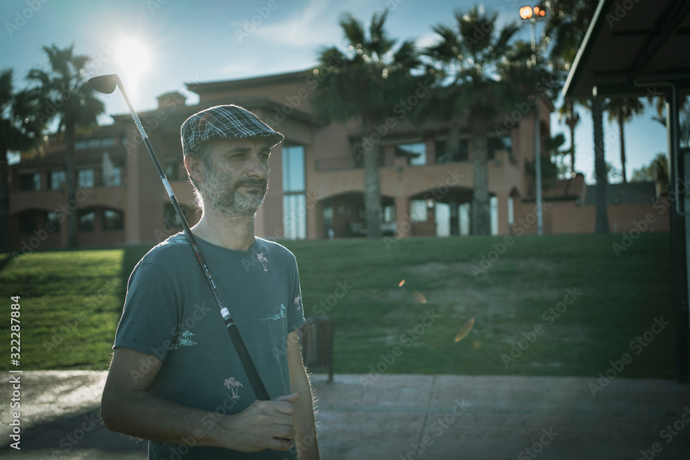 player holding a golf club