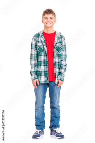 Full length portrait of young caucasian teen boy, isolated on white background. Handsome child -Funny teenager looking at camera and smiling.