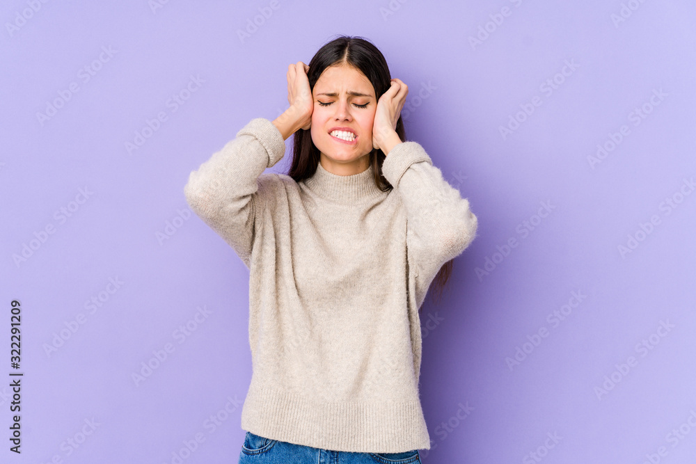 Young caucasian woman isolated on purple background crying, unhappy with something, agony and confusion concept. Young caucasian woman isolated on purple background crying, unhappy with something, agony and confusion concept.