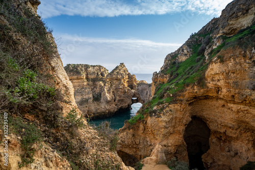 Scenic natural cliff formations and arches of Algarve coastline with turquoise water at Ponta da Piedade, in Algarve Portugal