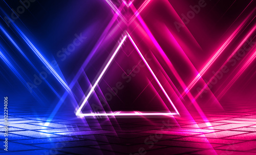 Dark abstract futuristic background. The geometric shape of a triangle in the middle of the scene. Neon blue-pink rays of light on a dark background