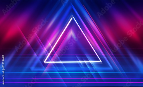 Dark abstract futuristic background. The geometric shape of a triangle in the middle of the scene. Neon blue-pink rays of light on a dark background