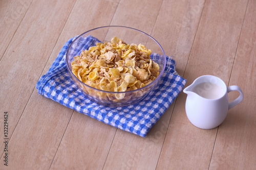 corn flakes in a bowl with milk for morning breakfast