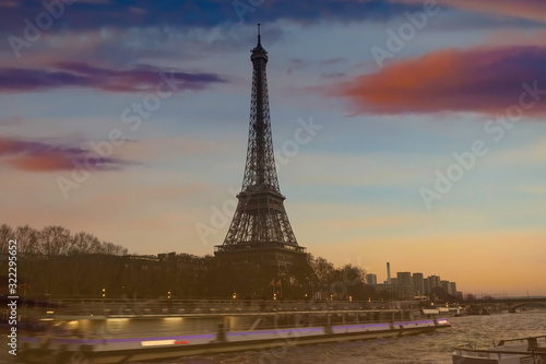 Motion blur of boat in the seine river with Eiffel tower, Paris. France ,sunset sky scene