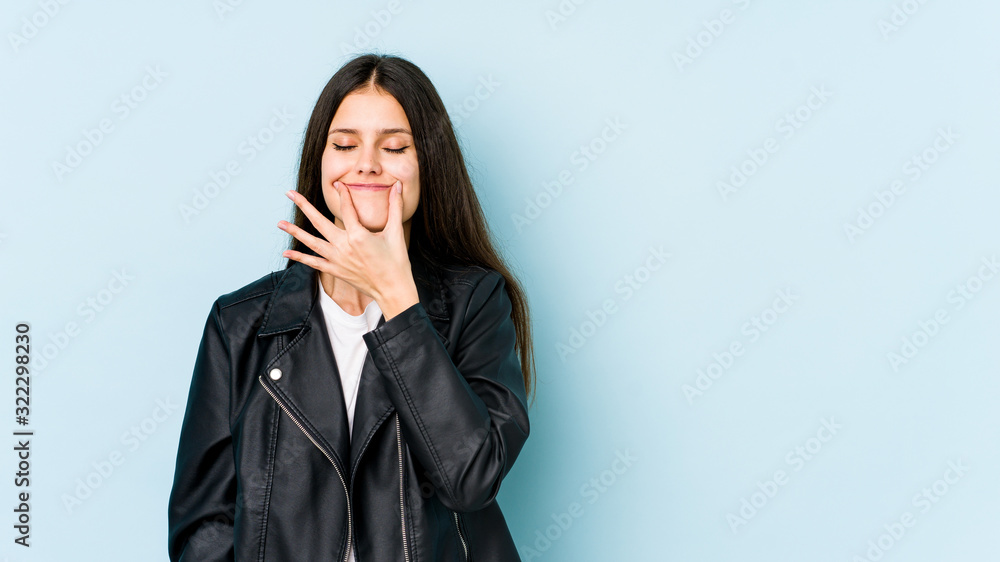 Young caucasian woman isolated on blue background doubting between two options. Young caucasian woman isolated on blue background doubting between two options.