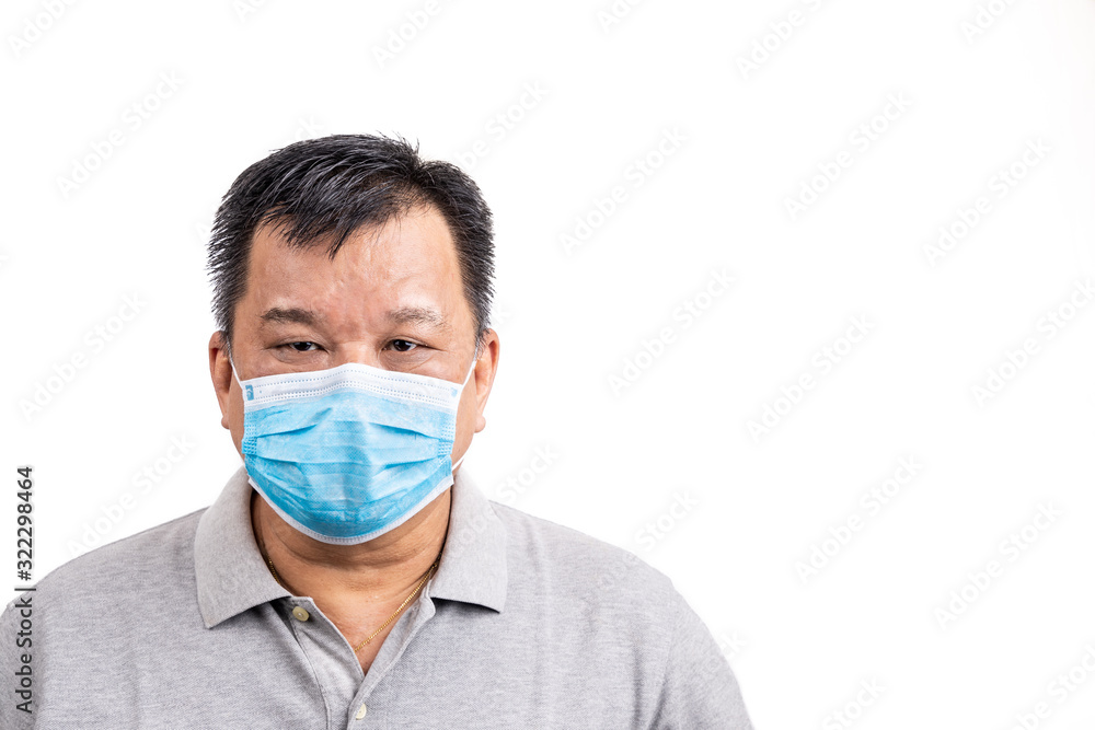 Concerned mature Asian Chinese man with face mask for protection
