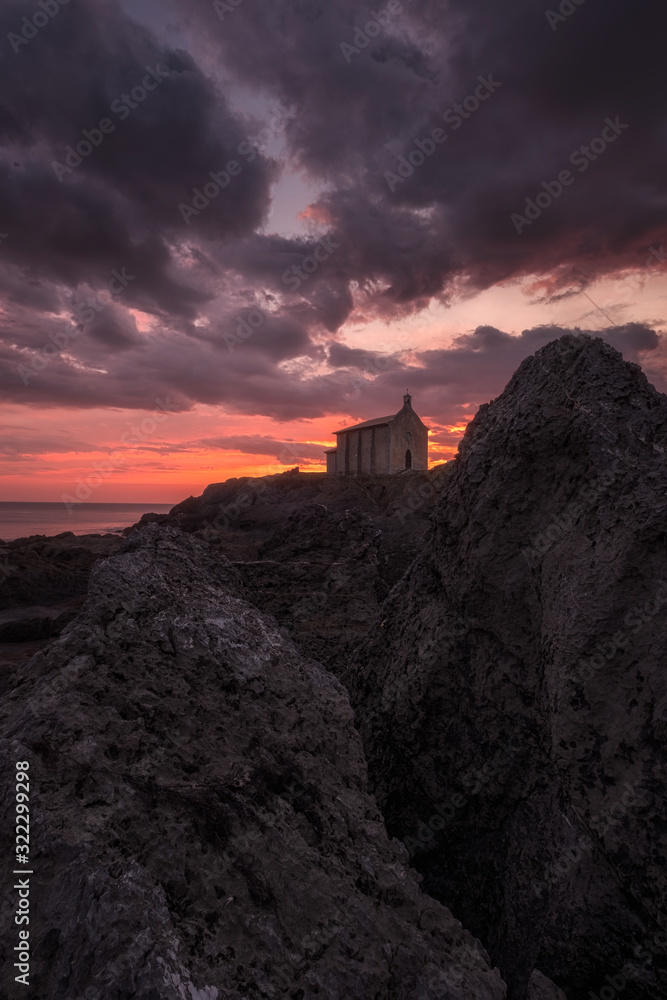 Santa Catalina, a small church near the sea in Mundaka (Spain) at sunrise. Santa Catalina, a small church near the sea in Mundaka (Spain) at sunrise.