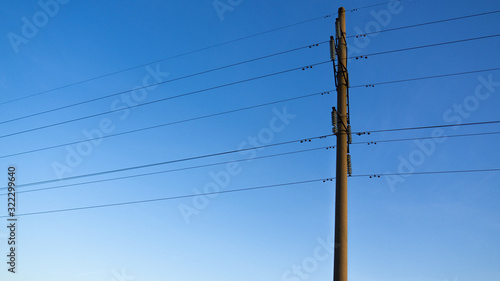 High-voltage line mast against the sky