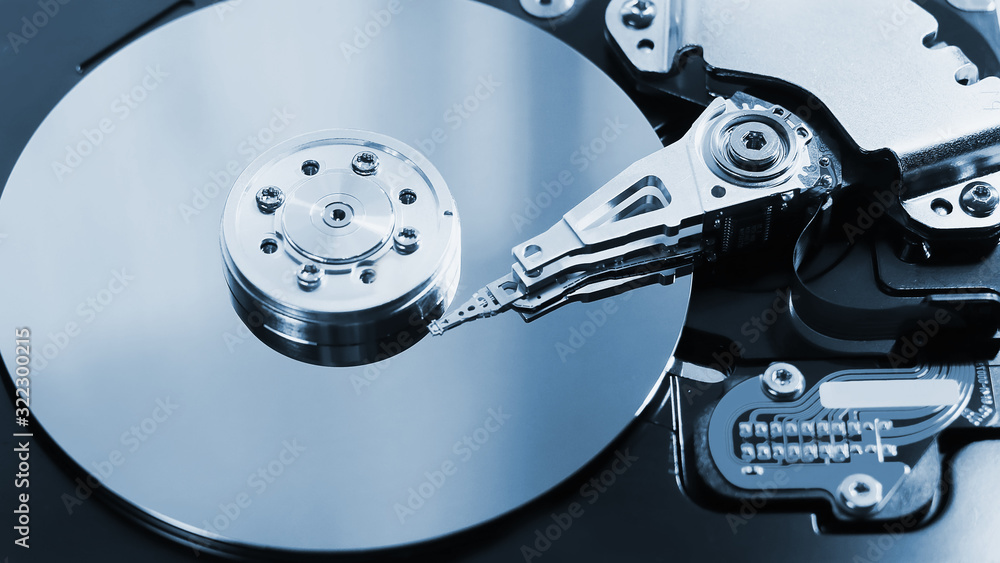 disassembled hard drive. computer component hdd with a mirror effect. close-up. disassembled hard drive. computer component hdd with a mirror effect. close-up.