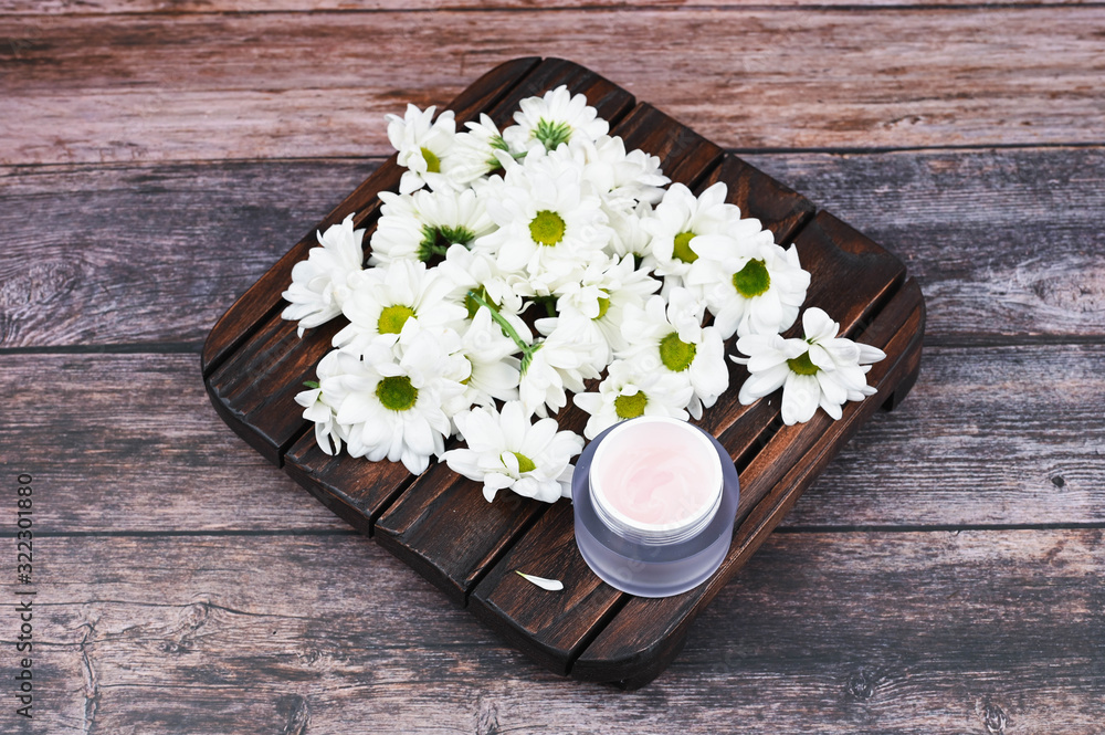 Fototapeta premium Eco cream on a wooden background. Natural creams for healthy skin. Natural cosmetic. The concept of natural medicine. flat lay.
