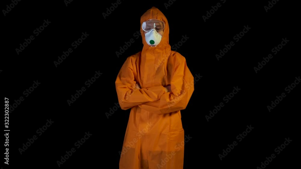 People can be infected with a deadly coronavirus study, close-up. jumpsuit chemical protection. The young man defends himself against the virus. People can be infected with a deadly coronavirus study, close-up. jumpsuit chemical protection. The young man defends himself against the virus.