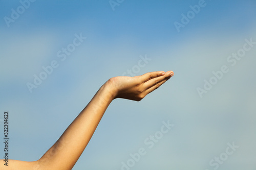 The hand image that contrasts with the blue background