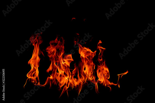 On fire flames at the black background © Thicha