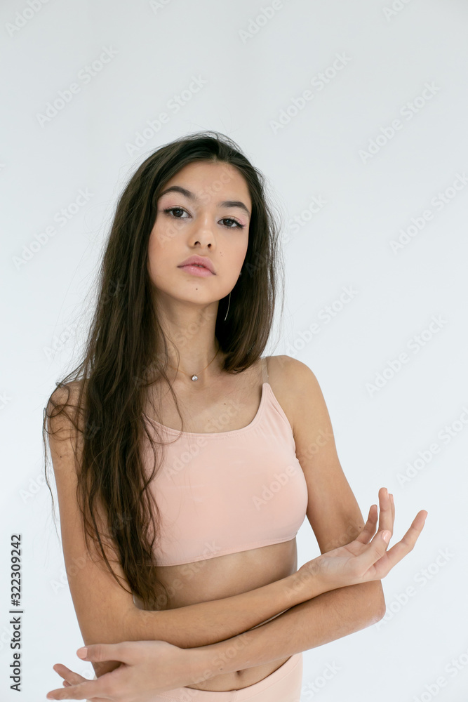vertical photo of a young long-haired dancer on a white background vertical photo of a young long-haired dancer on a white background