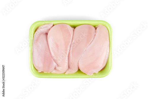 Raw chicken fillet in a green tray ,isolated on white background