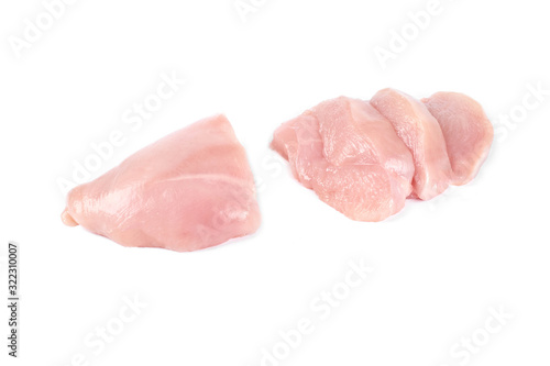 Raw chicken fillet and slices of chicken fillet isolated on white.