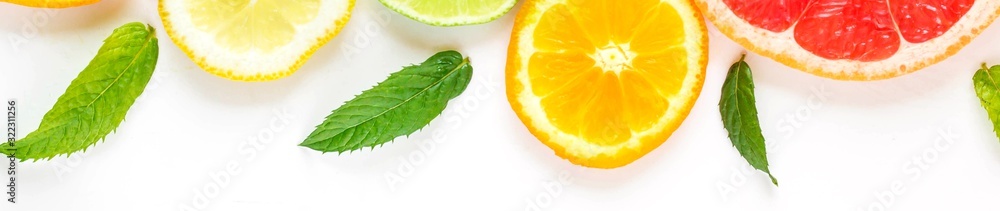 banner of citrus food pattern on white background - assorted citrus fruits with mint leaves. Isolated on white background banner of citrus food pattern on white background - assorted citrus fruits with mint leaves. Isolated on white background