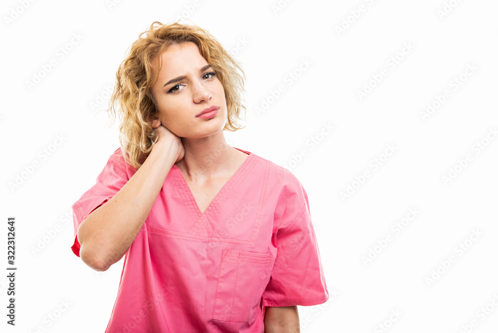 Portrait of nurse wearing pink scrub holding neck like hurting Portrait of nurse wearing pink scrub holding neck like hurting
