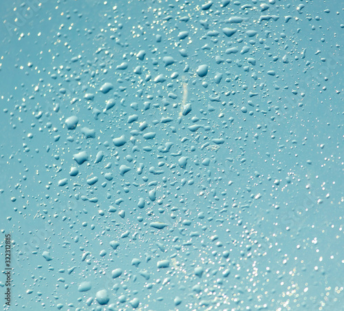 Drops of water on a blue glass window