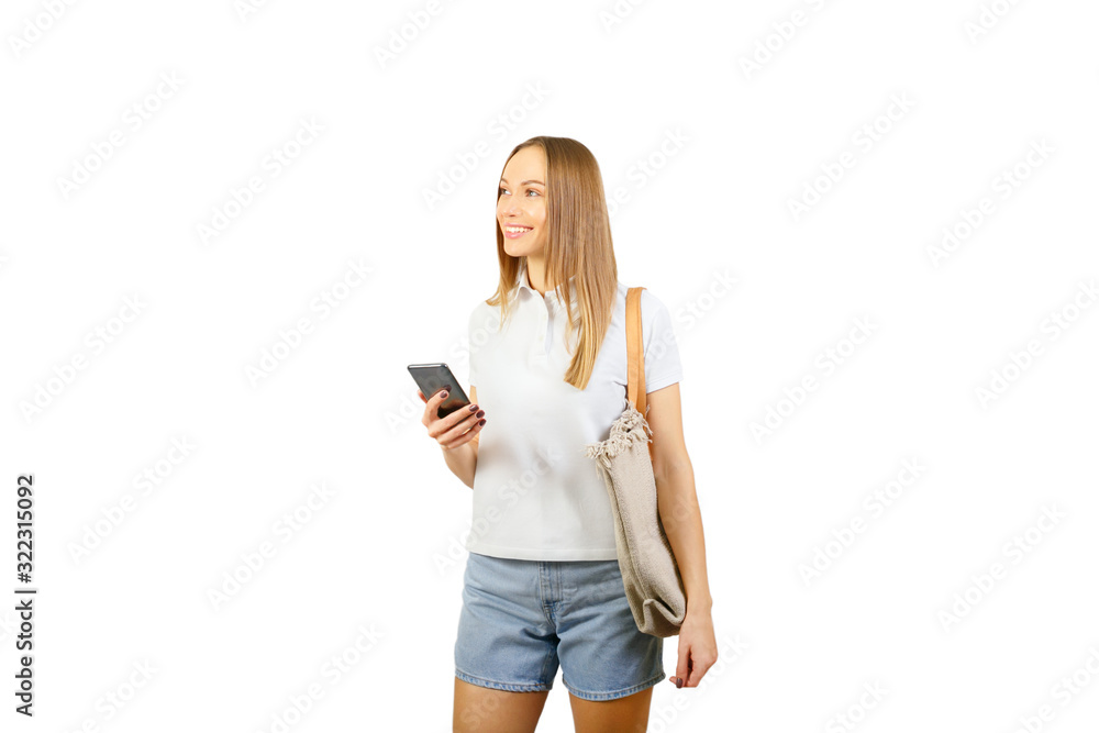 Smiling mature woman using smartphone isolated on white. Beautiful female model with phone and a bag. Smiling mature woman using smartphone isolated on white. Beautiful female model with phone and a bag.