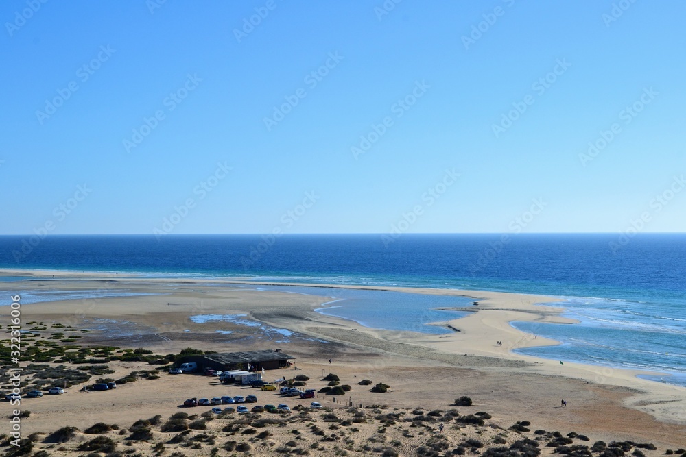 View on famous, wide beach Playa de Sotavento, Canary Islands, Fuerteventura, Spain. One of the best windsurfing beaches in the world