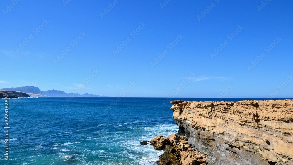 Rocks formation near La Pared beach on the western coast of Fuerteventura, Canary Islands, Spain. Popular spot for surfers. The wild coast of Playa La Pared