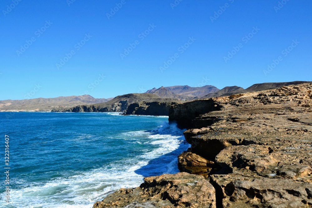 Rocks formation near La Pared beach on the western coast of Fuerteventura, Canary Islands, Spain. Popular spot for surfers. The wild coast of Playa La Pared
