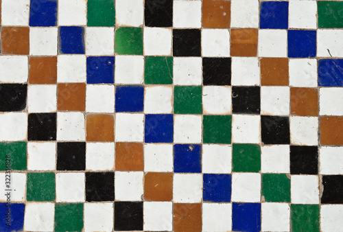 Cube shaped blue, brown, black and green floor surface structure 