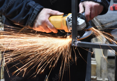 Grinding metal profile with sparks