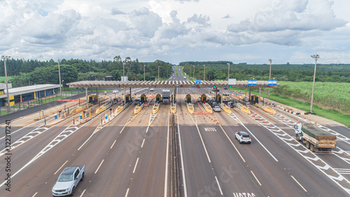 Aerial image highway toll plaza and speed limit, view of automatic paying lanes, non-stop. photo