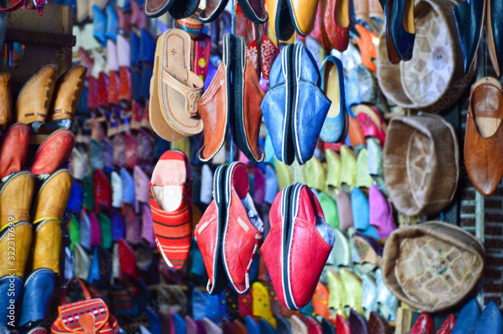 Typical arabic shoes and hats in on of the many souks in Marrakech