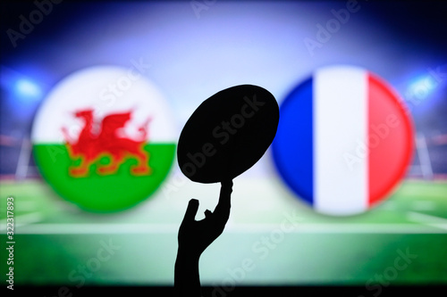 Wales vs France, Six nations Rugby match, Rugby ball in hand silhouette photo