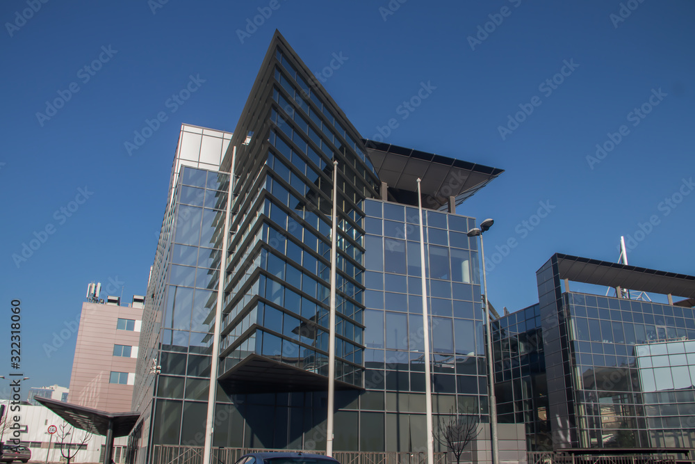 Urban metropolis modern architecture. Exterior with glass walls, reflecting surrounding buildings. Brand new buildings for business and office purposes. Belgrade, Serbia, 09.02.2020