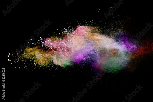 Abstract powder splatted background. Colorful powder explosion on black background. Colored cloud. Colorful dust explode. Paint Holi.