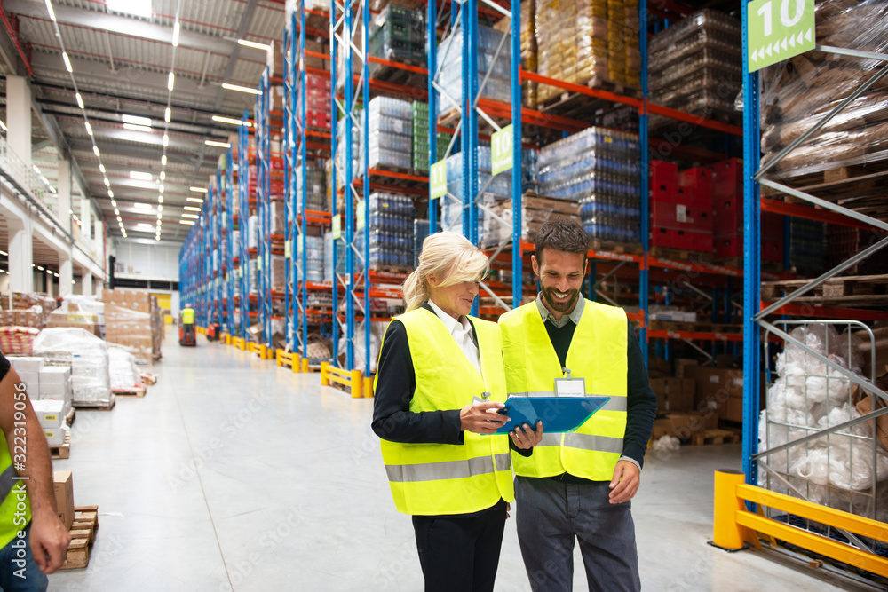 Managers in Warehouse discuss about business strategy Managers in Warehouse discuss about business strategy