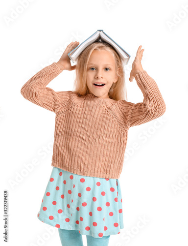 Little girl with book on wh...