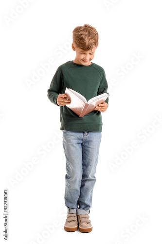 Little boy reading book on white background