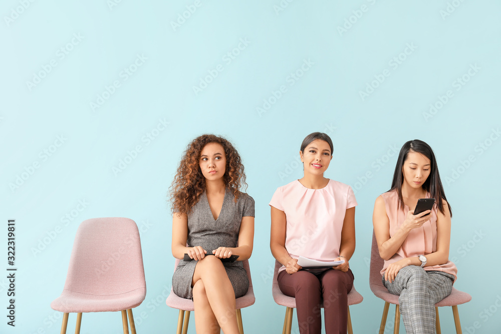 Fototapeta premium Young women waiting for job interview indoors