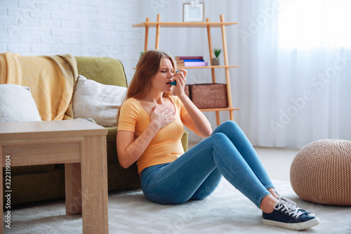 Young woman with inhaler ha...