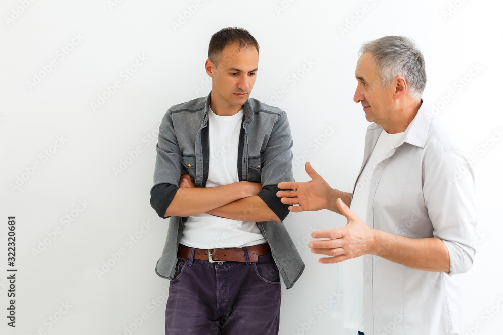 Mature father and son, quarrel, isolated on white background Mature father and son, quarrel, isolated on white background
