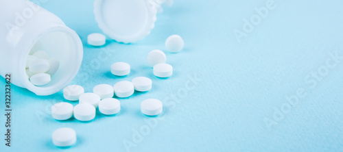 White tablets on a blue-green background. Copy space for text or disign