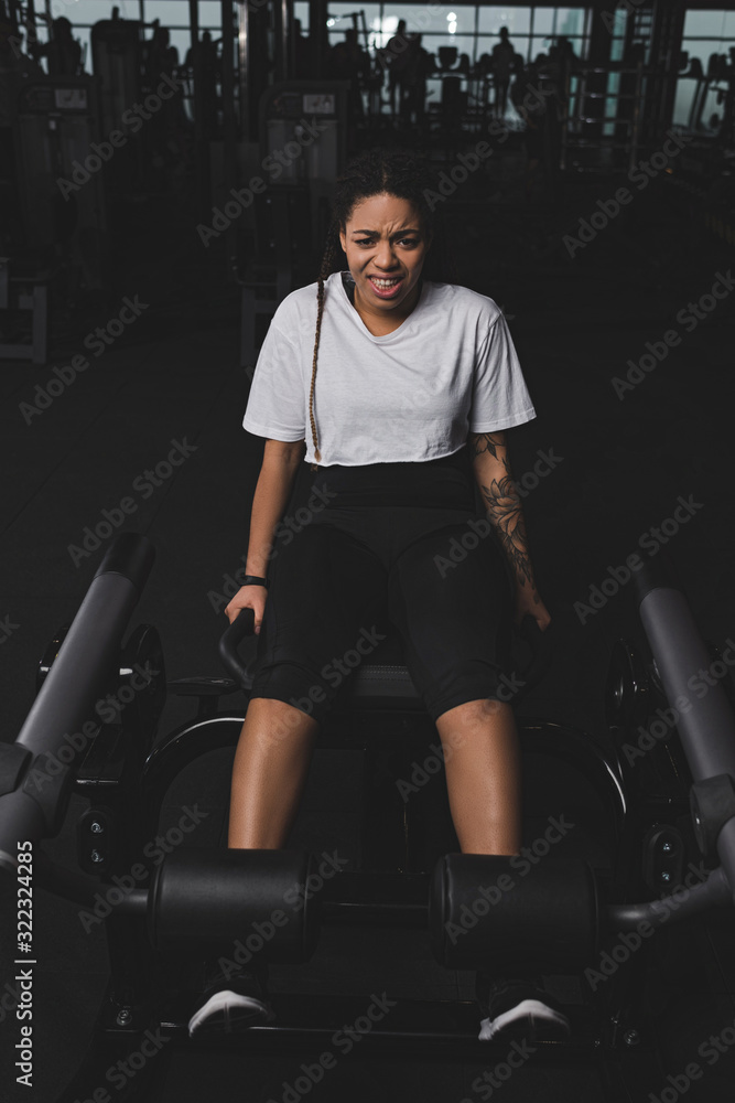 African american woman doing exercise for abs in gym African american woman doing exercise for abs in gym