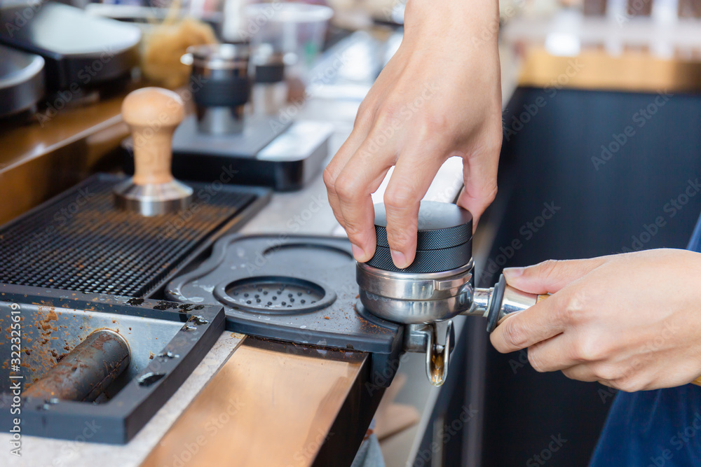 Close up of Barista hand making coffee on the machine Close up of Barista hand making coffee on the machine